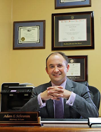 Photo of attorney Adam E. Schramm at his desk